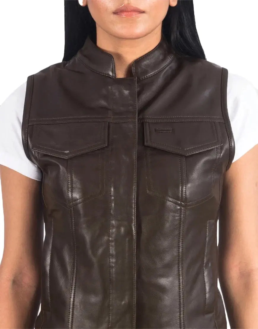 Brown leather vest worn by a person on a white background